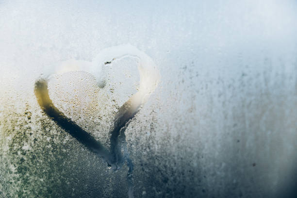 istock heart at foggy window 872761506