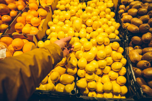 istock first person view man buying lemon 872761948