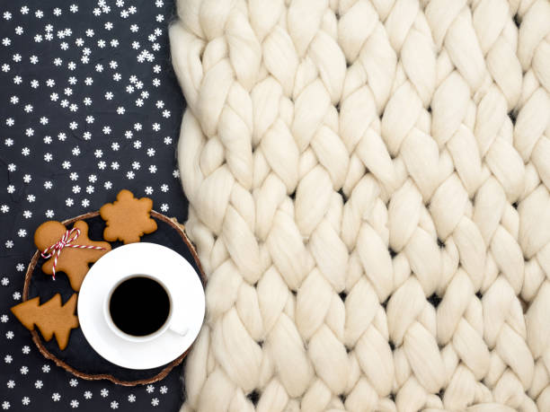 istock Cozy composition, closeup merino wool blanket, warm and comfortable atmosphere. Knit background. Cup of coffee and ginger cookies. Christmas concept. 872762074