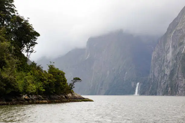 A rainy Milford Sound provides a waterfall-rich early summer landscape.