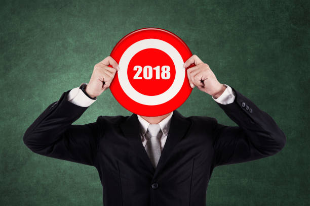 istock Businessman covering his face with number 2018 872768168