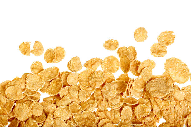 Corn flakes background on white Corn flakes background on white. High resolution photo. corn flakes stock pictures, royalty-free photos & images