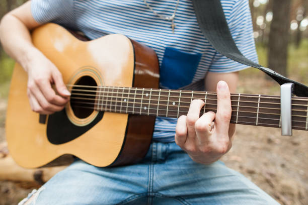 istock Music lifestyle man playing guitar nature concept. 872772412