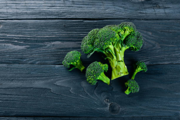 istock Broccoli. On a wooden background. Top view. Free space for your text. 872772732