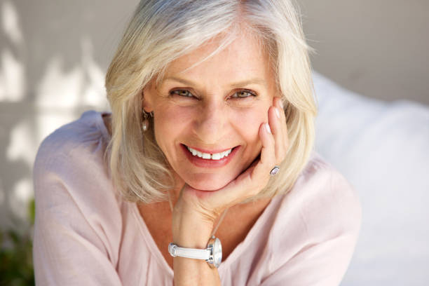 istock Close up mature woman smiling outside 872772774