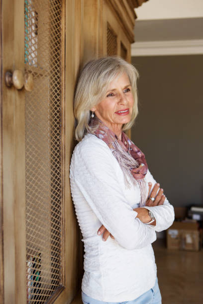 istock senior woman smiling at home 872772840
