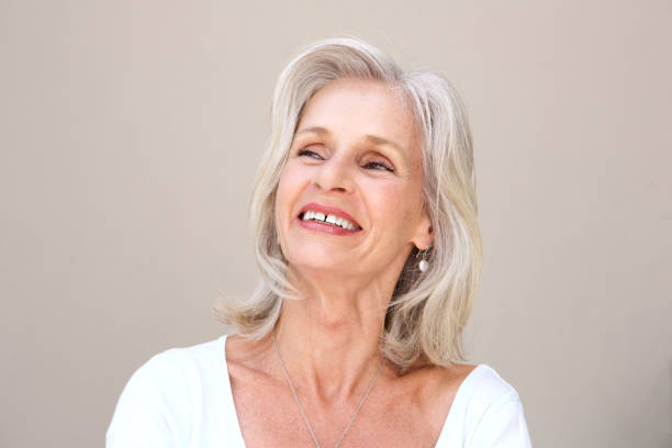istock Close up happy senior woman smiling 872772876