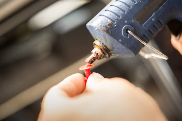 istock Repairing dents in a car 872779238