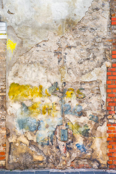 istock colorful painted abandoned brick wall background 872779486