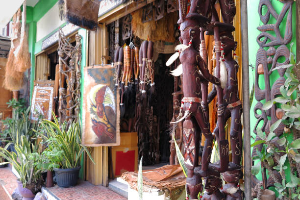 Papua handicrafts A souvenir shop in the market of Hamadi Jayapura that sells various ethnic handicrafts from Papua koteka stock pictures, royalty-free photos & images