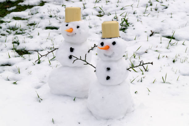 istock Two snowmen handmade in the snow. 872783040