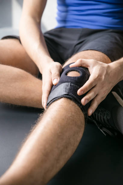 istock Sports injuries, bandaged knee 872786370