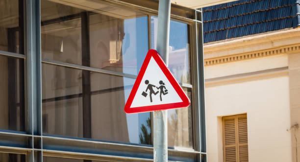 istock attention to children panel placed in front of a modern glass building 872786698