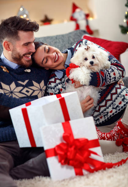 istock couple in love opening presents for Christmas 872786868