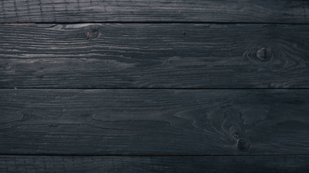 istock Wooden black texture background. Top view. Free space for your text. 872789798