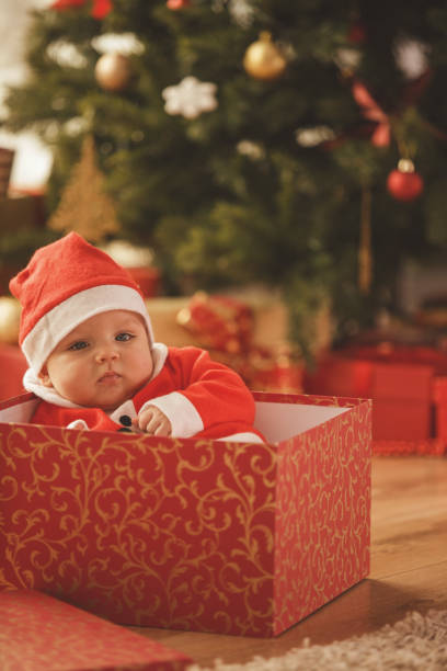 istock Cute baby boy in a gift box 872791462