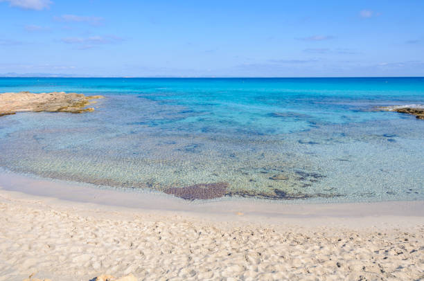 The white sand Ses Platgetes Beach in Formentera, Spain stock photo