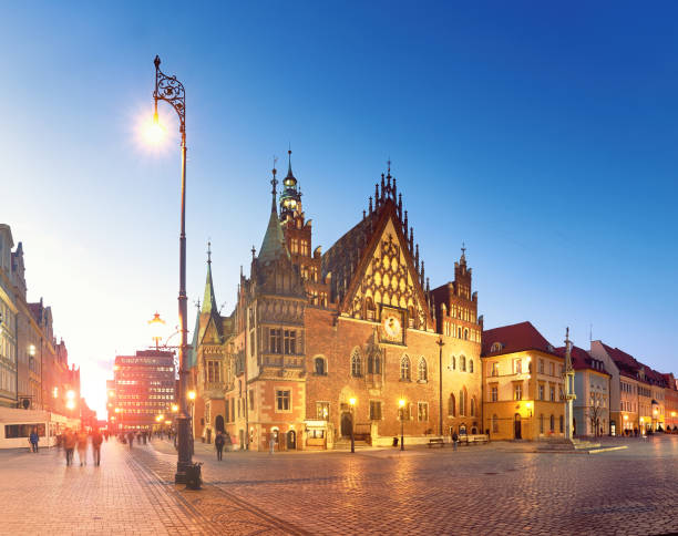 istock Market square and Town Hall at night, panoramic image 872794356