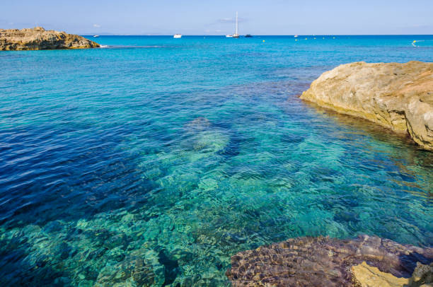 Transparent sea in Es Calo de Sant Agusti Cove in Formentera, Spain stock photo