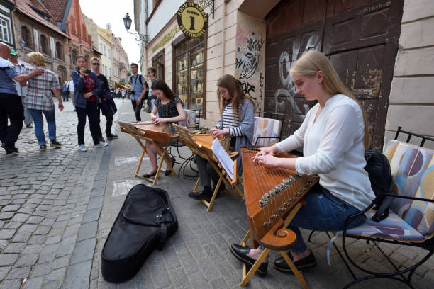 Vilnius, Lithuania - May 20: Unidentified musician play Lithuanian plucked string instrument (Kankles) in Street Music Day on May 20, 2017 in Vilnius. Its a most popular event on May in Vilnius.