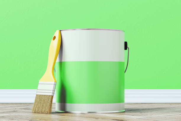 istock Green paint bucket and a brush 872797528