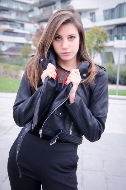 istock Young woman holding her jacket 872799668