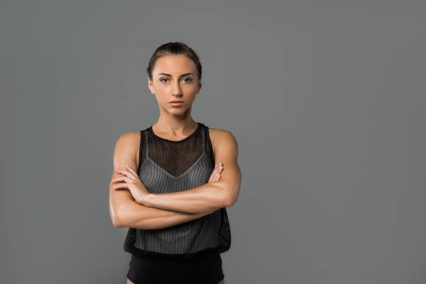 istock beautiful girl with crossed arms 872799712