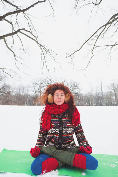 istock yoga on snow field 872799916