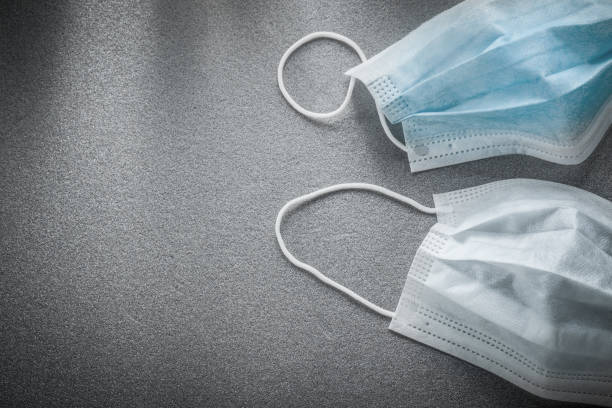 istock Sterile flu masks on grey background 872802676