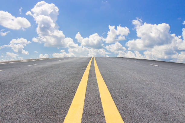 istock Flat road and sunny sky, transportation industry 872806518