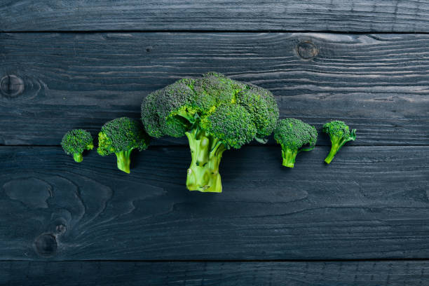 istock Broccoli. On a wooden background. Top view. Free space for your text. 872806690