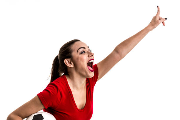 istock Soccer woman on red uniform isolated on white background 872807568