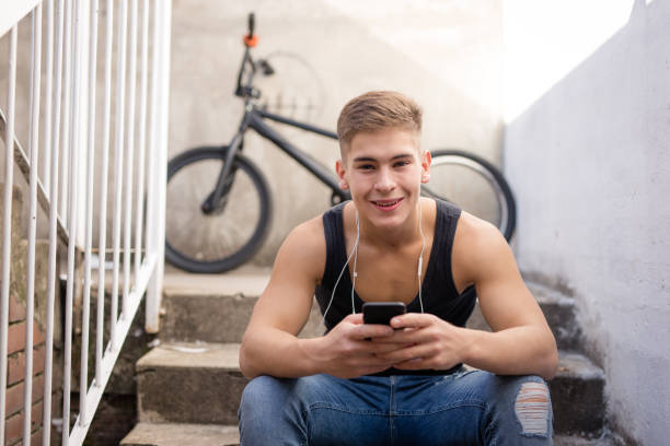 istock Teenage boy giving a smile 872809926