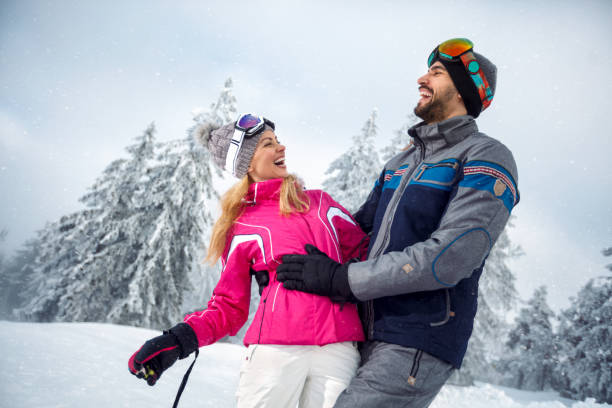 istock young couple having fun on winter vacation on the mountain 872810570