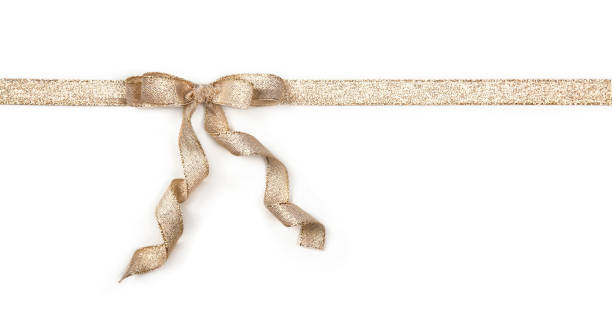 istock Golden ribbon with a bow 872810904