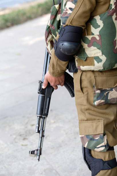 istock Warrior holding a automatic machine. New Delhi, India 872811052
