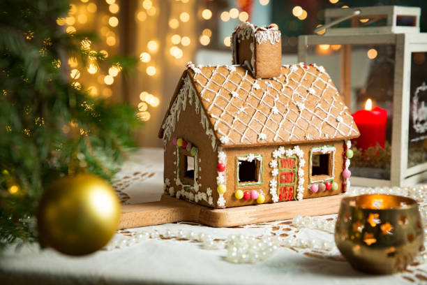 Little gingerbread house with glaze standing on table