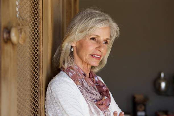 istock Close up beautiful older woman thinking 872814812
