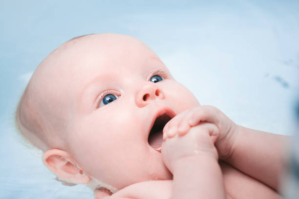 istock happy baby enjoying a bath 872817632