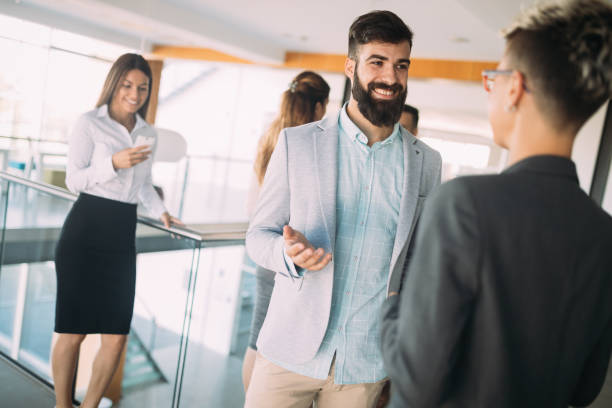istock Young designers talking on break about business plans 872818166