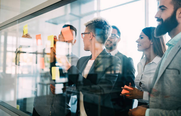 istock Picture of designers sticking notes in office 872818760