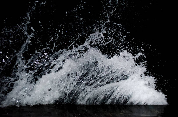 Splashing wave on the Black sea in the night.