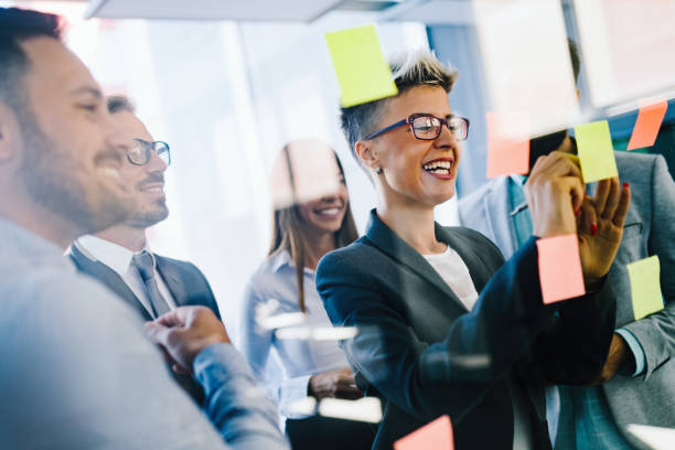 istock Picture of designers sticking notes in office 872818810