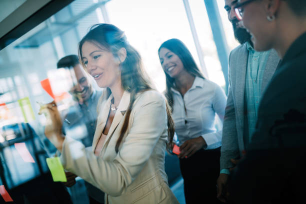 istock Picture of designers sticking notes in office 872818854