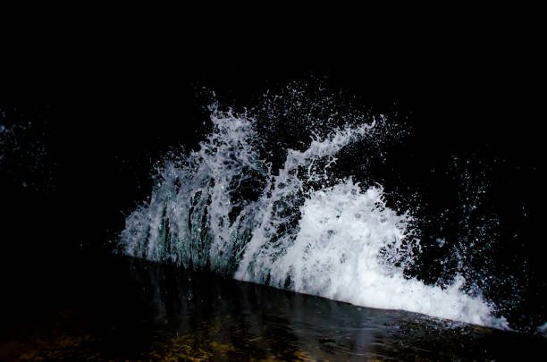 Splashing wave on the Black sea in the night.
