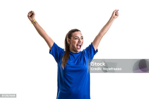 Fan Sport Player On Blue Uniform Celebrating On White Background Stock Photo - Download Image Now
