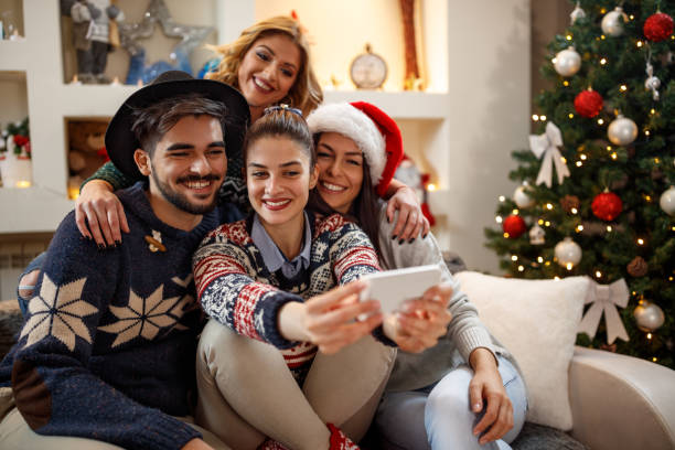 istock Group of young people taking Christmas selfie 872821794