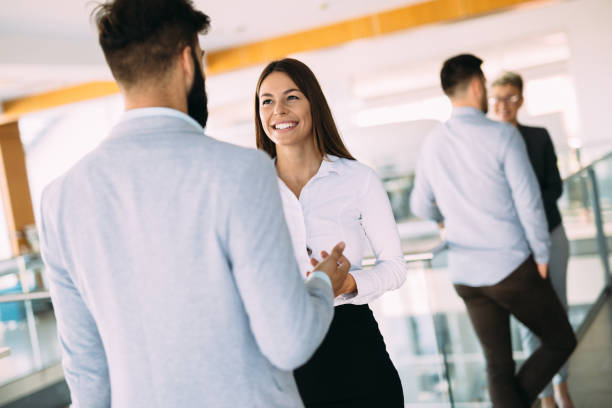 istock Young designers talking on break about business plans 872825096