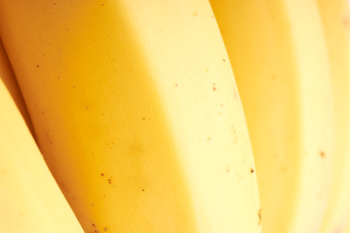 Yellow vibrant background ripe banana
