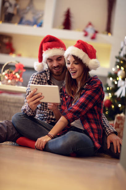 istock Female with male celebrate Christmas 872828042